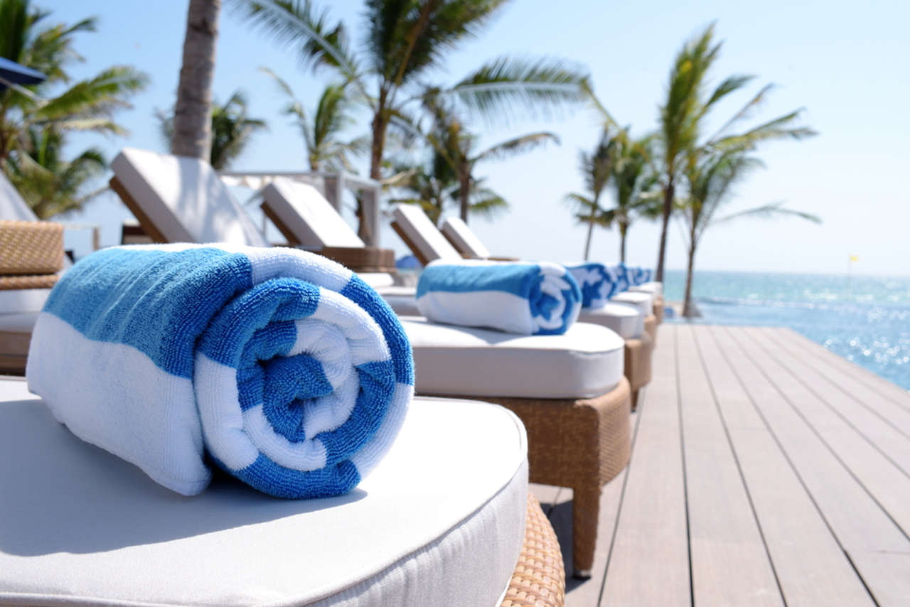 blue and white beach towel 