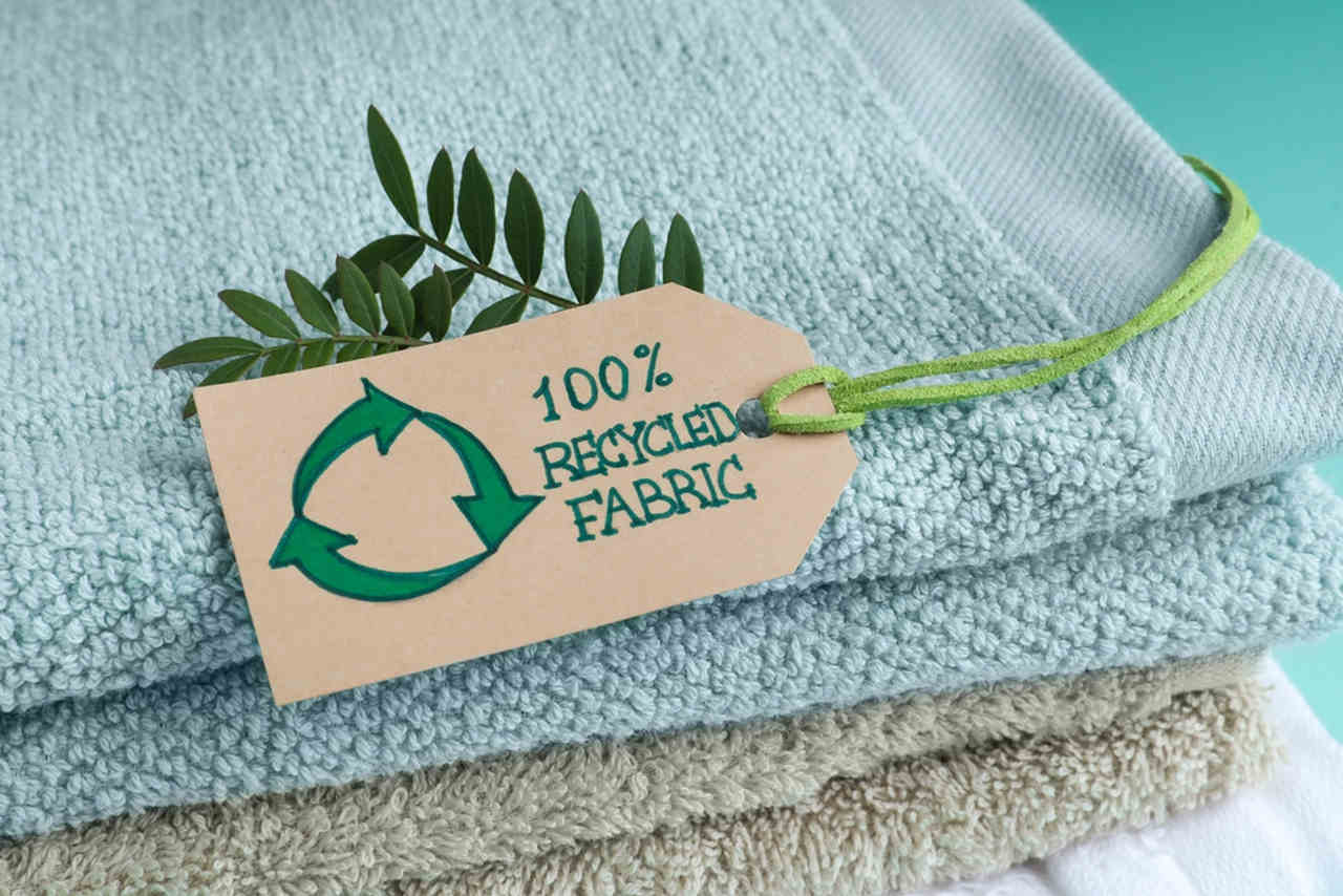 towel with a recycle sign on it