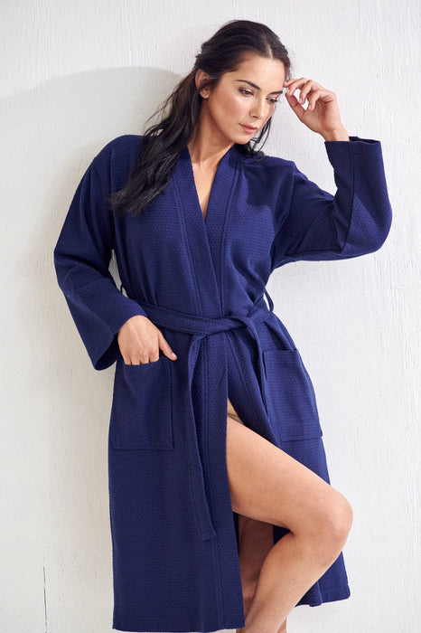 a woman who wears a blue bathrobe